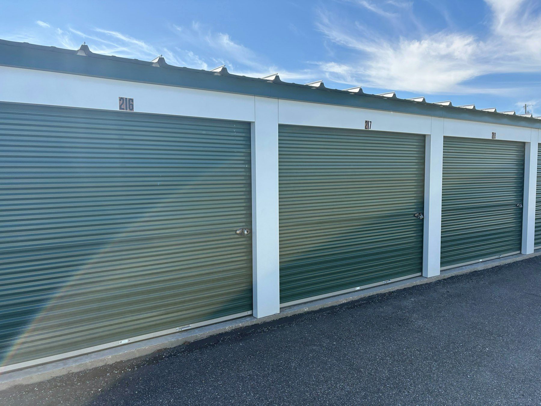 Drive-up storage units with green roller doors
