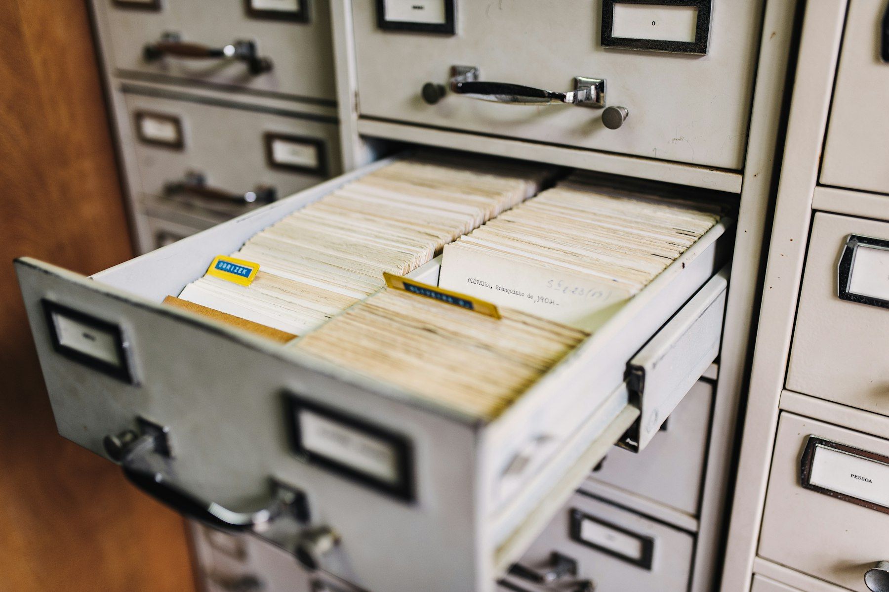 Open filing cabinet drawer full of records