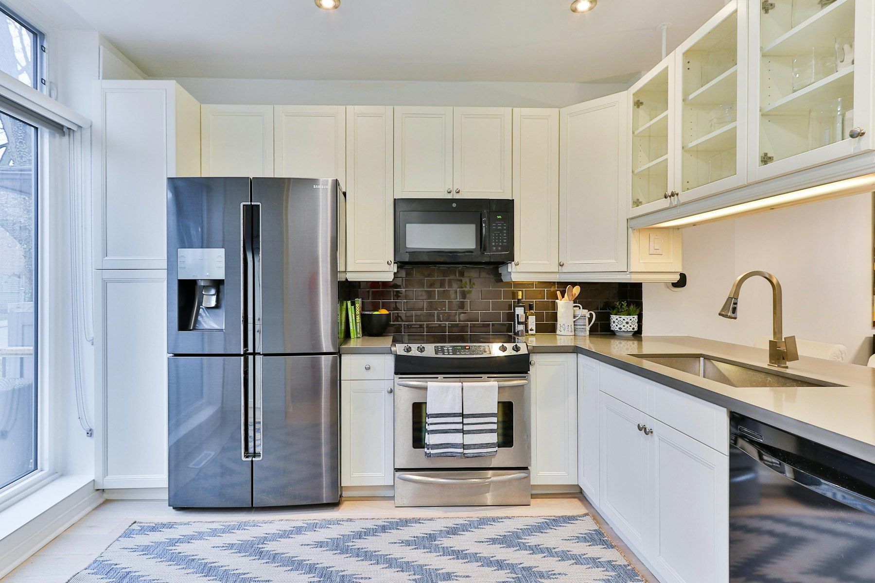 Stainless steel fridge in a fitted kitchen