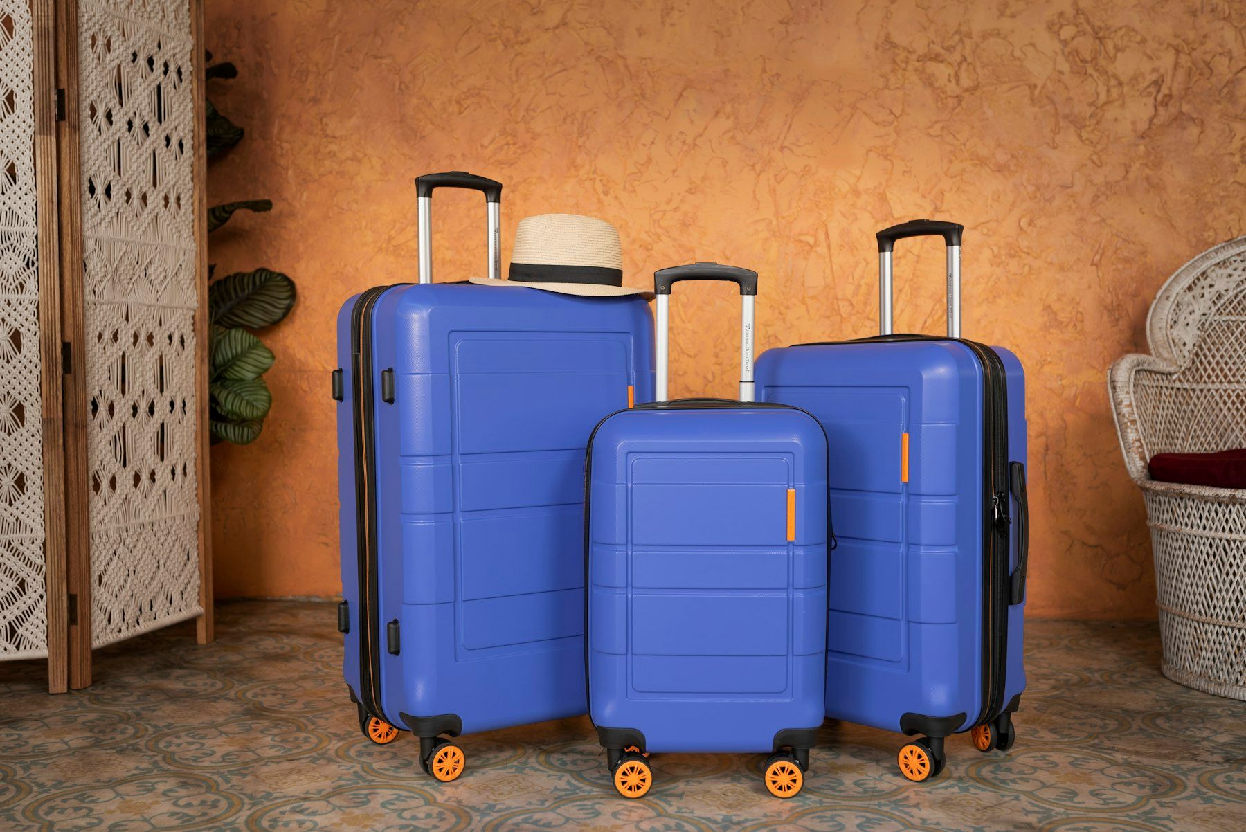 Set of three blue hard-shell suitcases