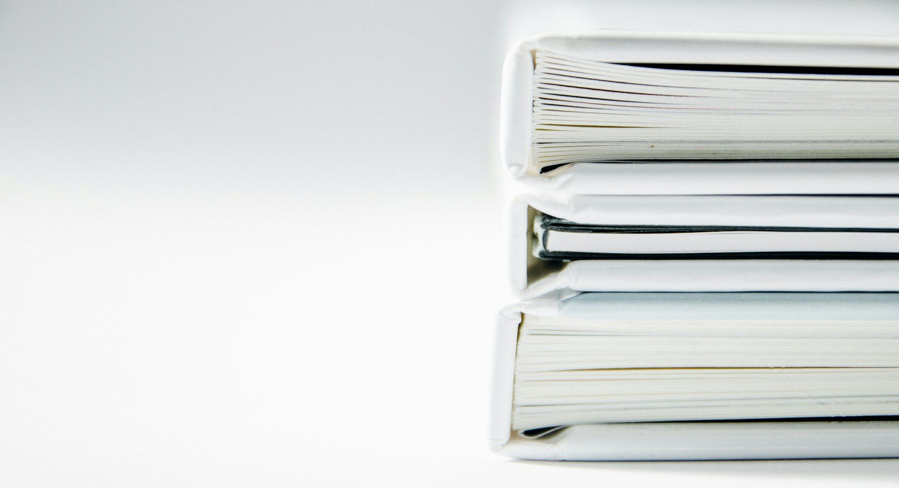 Stack of white ring binders