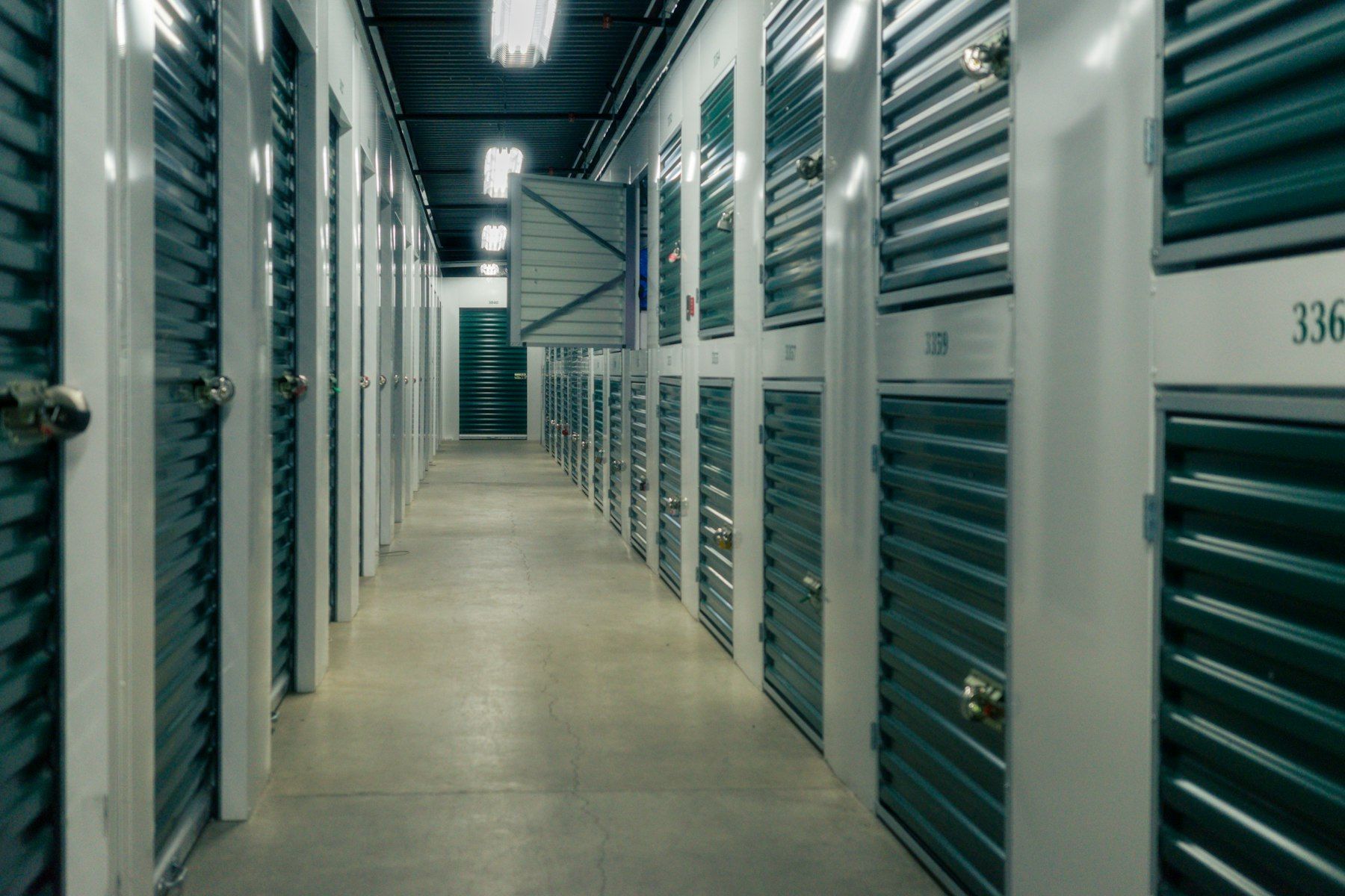 Indoor corridor of storage units with roller doors