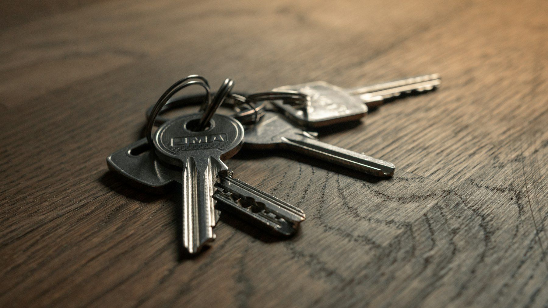 Set of keys on a wooden table
